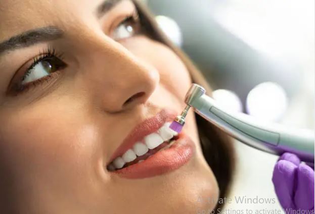 Women having tooth cleaning